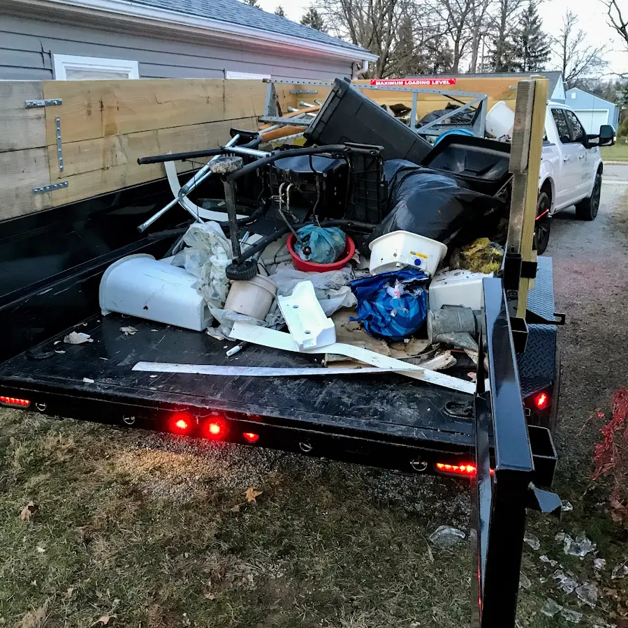 Roll-off dumpster delivered to a residential driveway in Asbury Lake
